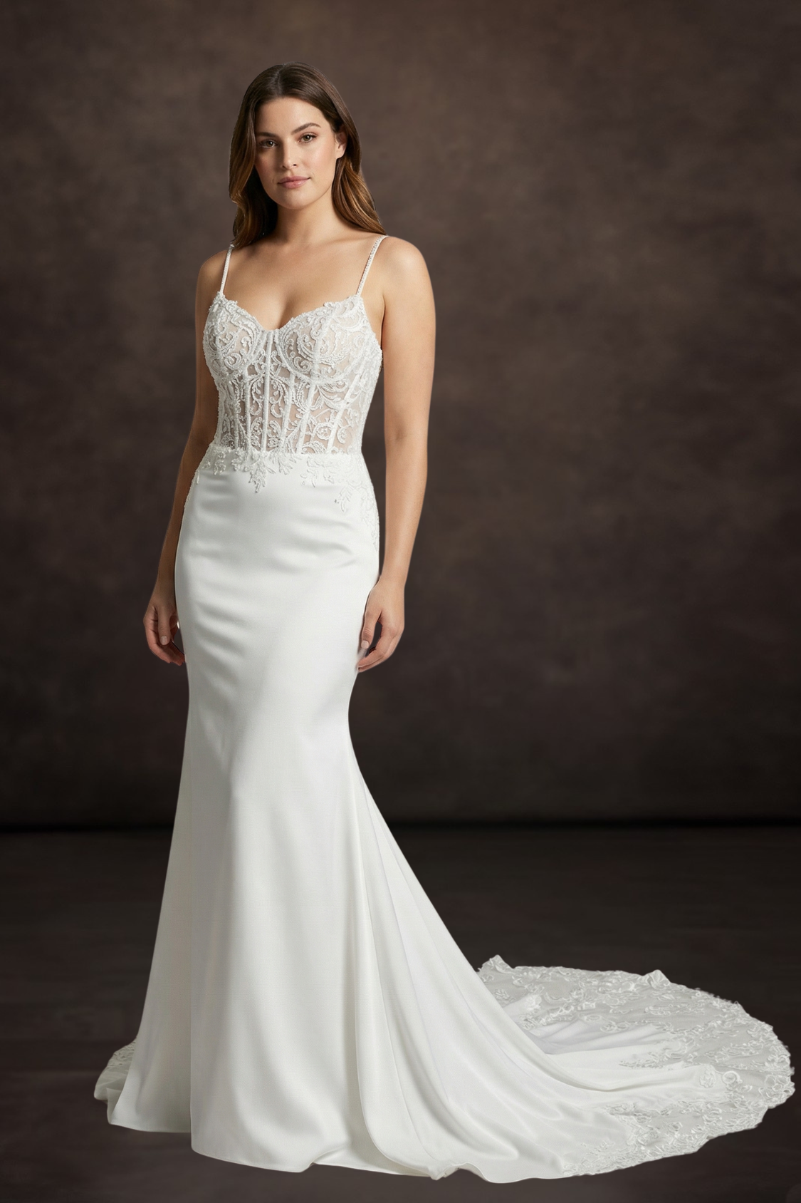 White wedding dress with lace detailing on a dark background